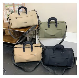 Detail of four waterproof oxford travel bags in beige, olive, khaki and black colors