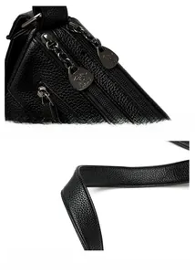Detailansicht des hochwertigen schwarzen Leder-Reißverschlusses und des breiten Schultergurts