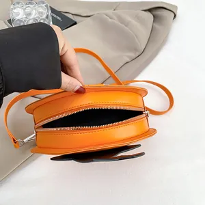 Vibrant orange pumpkin crossbody bag in PU leather with cartoon cat ears for Halloween