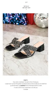 Detail of black rhinestone cross strap sandals with low block heels for party wear