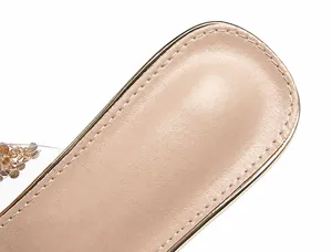 Macro shot of breathable leather lining and precision stitching on beige platform sandals
