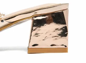 Detail of rose gold block heel with metallic ripple texture on high heel sandals
