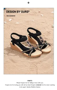 Detail of bohemian wedge sandals with black woven straps and wooden buckle on sandy beach