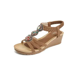 Bohemian wedge sandals with colorful beads and braided straps in brown synthetic leather