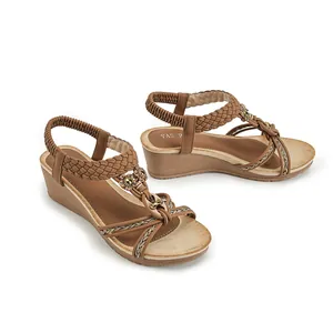 Sandales compensées bohèmes pour femmes avec brides tressées et boucle soleil dorée