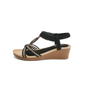Bohemian wedge sandals with black suede straps, braided details and wood grain heel