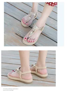 Detail of bohemian flat sandals with sparkling rhinestones and elastic heel strap