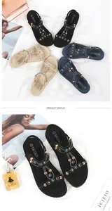 Detailed view of bohemian sandals with intricate beadwork and rhinestones decoration