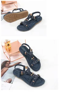 Detail of blue flat sandals featuring beaded T-strap, rhinestones and anti-slip sole