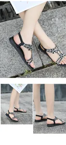 Detailed view of bohemian flat sandals featuring sparkling rhinestone floral T-strap design