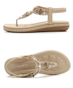 Close-up of Bohemian apricot sandals with sparkling rhinestones and beaded T-strap details