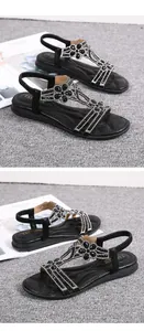 Detailed close-up of black bohemian sandals with sparkling floral rhinestone patterns