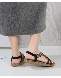 Detail showing Bohemian black flat sandals with colorful beads and elastic heel strap