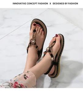 Detail of bohemian flat sandals featuring intricate floral beadwork and woven wood beads