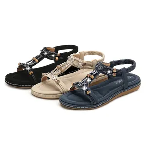 Women's flat sandals with rhinestones and beads in black, beige, and navy colors