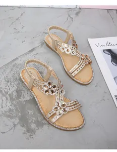 Sandales plates or champagne avec strass floraux et bride arrière élastique souple