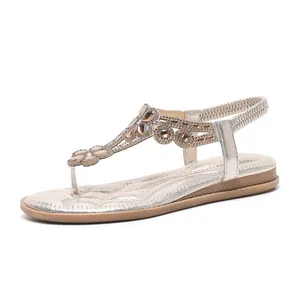 Sandales Plates de Style Bohème pour Femmes Fleur en Strass T-Strap Entre-doigt Bride Arrière Élastique Cuir Synthétique Chaussures d'Été