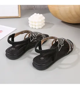 Detail view of black Bohemian flat sandals featuring rhinestones and size 37 mark
