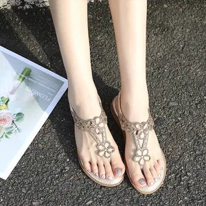 Sandales à lanières pour femmes avec fleurs en strass champagne et semelle argentée