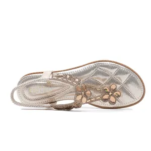 Sandales plates bohèmes avec fleurs en strass étincelants et semelle dorée matelassée