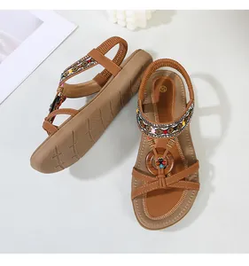 Detailed macro view of bohemian sandals with colorful beadwork and geometric embroidery