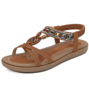 Bohemian flat sandals with brown braided straps, colorful beads and elastic heel strap