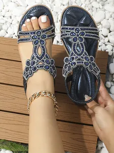 Detailed view of bohemian blue sandals with intricate crystal rhinestones and gems