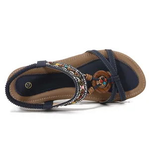 Navy blue bohemian flat sandals with ethnic beads and elastic strap for women