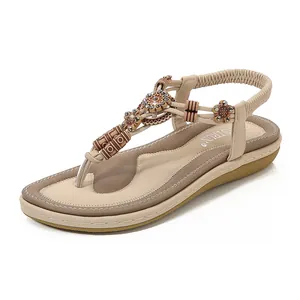 Bohemian women's T-strap flat sandals with vintage beads and elastic back strap in beige