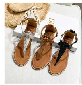 Flat gladiator sandals in beige black and brown faux snake skin with ankle strap detail