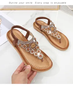 Details flache Bohème-Sandalen mit Strass-Blumenclustern und elastischem Fersenriemen