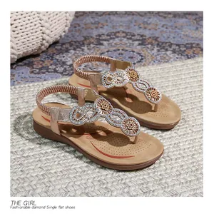 Close-up of bohemian rhinestone flip-flop sandals with braided elastic heel strap
