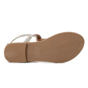 Detail view of anti-slip rubber sole with size 37 and snakeskin texture straps