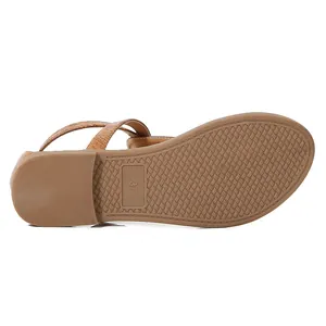 Detail of size 37 non-slip rubber sole on brown faux snakeskin bohemian flat sandals