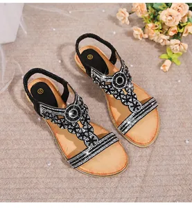 Detail of floral rhinestone embellishments on bohemian flat sandals with size 37 mark