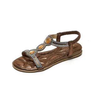 Boho-Flache Sandalen für Damen in Bronze mit T-Riemen und Bernstein-Strasssteinen