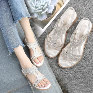 Silver flat sandals for women featuring T-strap rhinestones and bohemian floral patterns