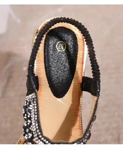 Macro detail of bohemian flat sandal showing rhinestone accents and size 37 gold insole