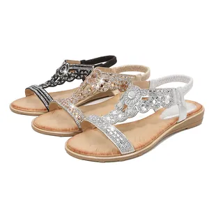 Flat Bohemian women's sandals with rhinestones in black, gold, and silver colors
