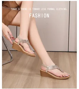 Detail of bohemian wedge sandals featuring rhinestone T-strap and elastic back strap
