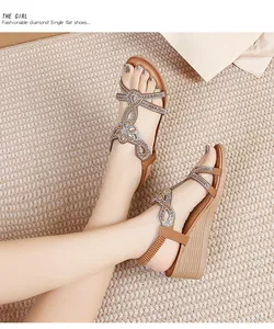 Detail view of Bohemian wedge sandals with sparkling rhinestones and elastic heel strap
