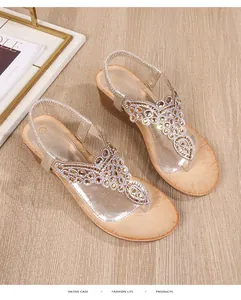 Detail of bohemian wedge sandals with sparkling rhinestones and cork texture in size 37
