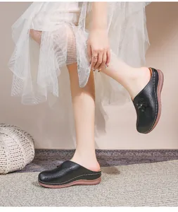 Detail of black hollow-out floral women's mule shoes with comfortable thick soft sole