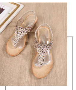 Detail of bohemian wedge sandal featuring intricate rhinestones and sequins on the upper