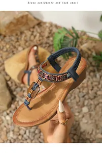 Detail of bohemian wedge sandal featuring intricate beadwork and sparkling rhinestones