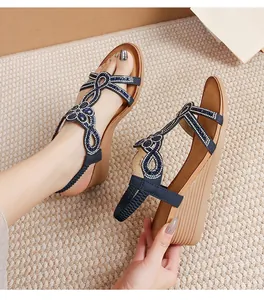 Detailed view of bohemian wedge sandals with sparkling blue rhinestones and elastic heel strap