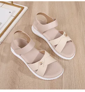 Detailed overhead view of bohemian nude sandals with braided straps and metal buckle