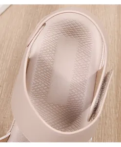 Close-up of pink ladies sandals featuring diamond-textured insole and cushioned heel pad