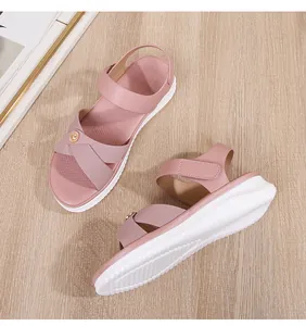 Detail of bohemian platform sandals with pink straps, metal buckle and velcro closure
