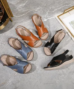 Detailed top view of summer flat sandals with cross-strap design in three colors